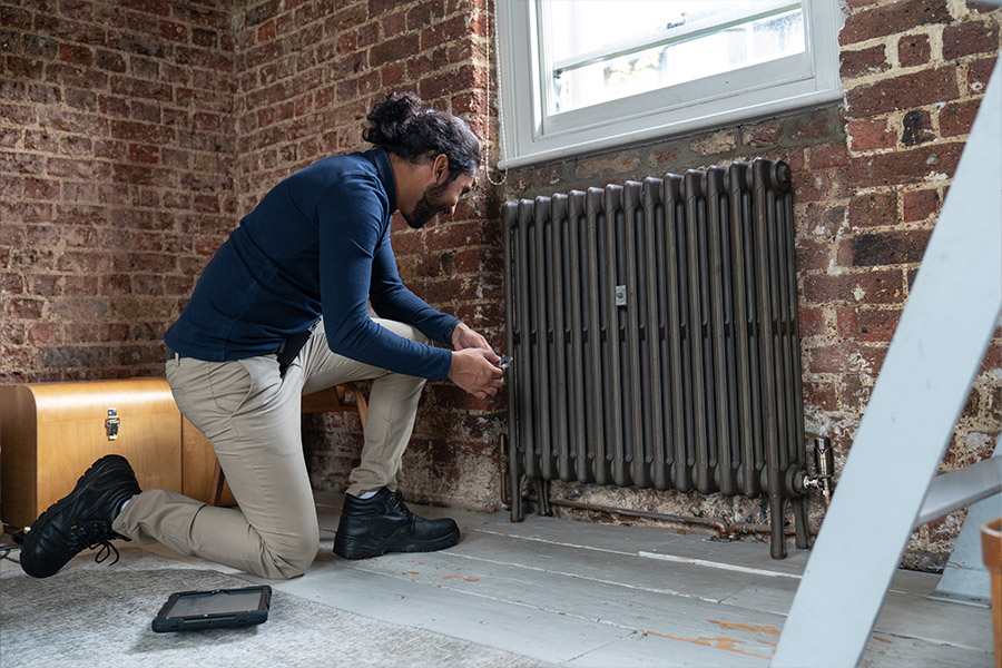 D&G engineer turning off a radiator